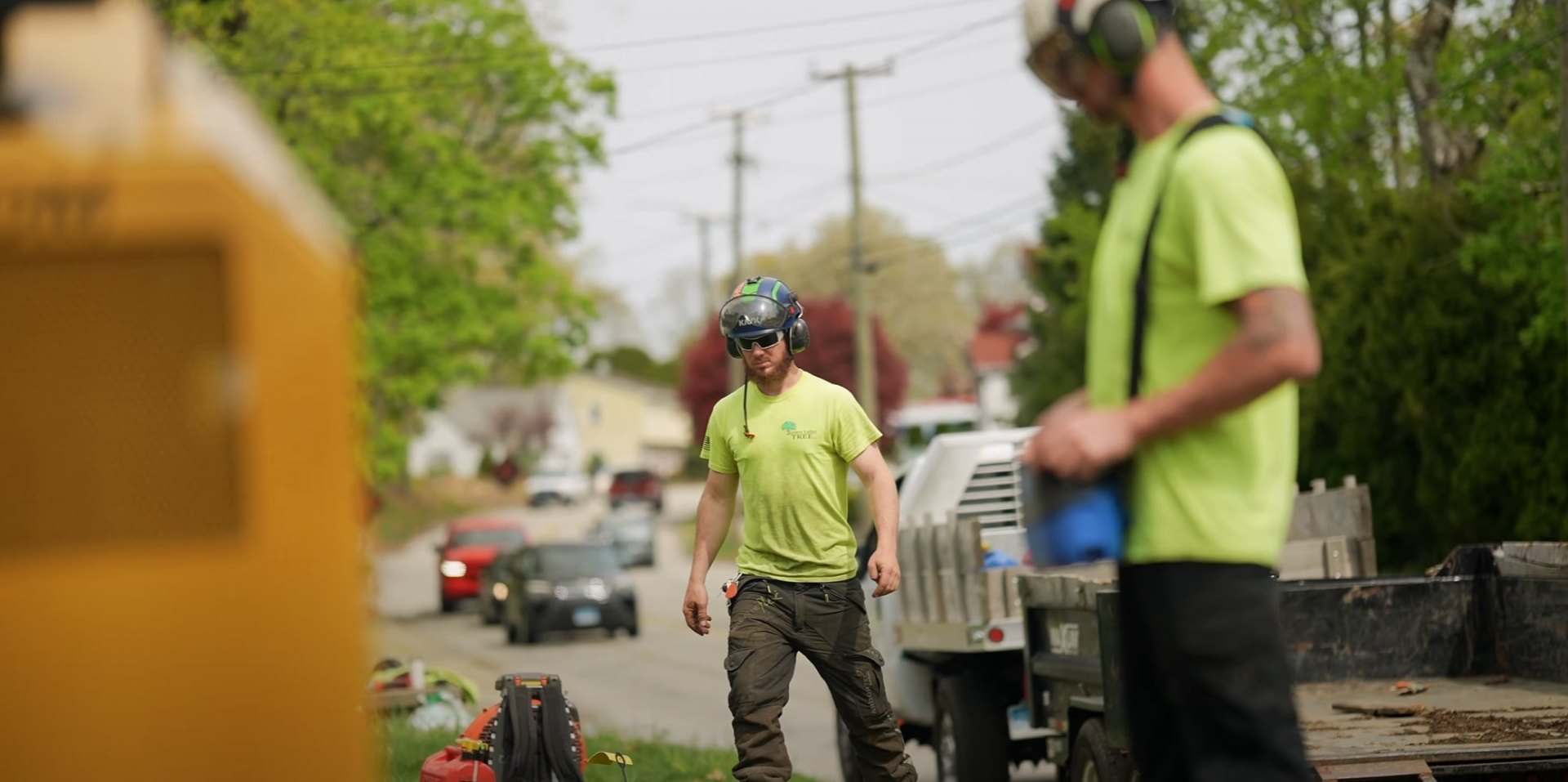 Certified Tree Service Professionals Certified tree service crew with safety equipment working on residential property